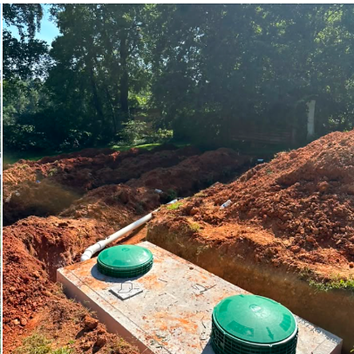Septic installation project with green tank lids